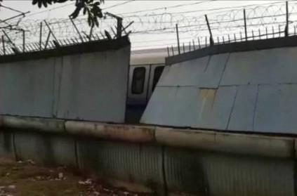 Boundary wall falls on moving metro