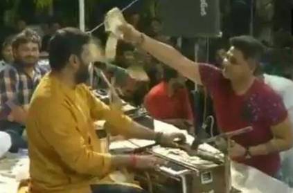 Folk singer being showered with lakhs and lakhs of money Folk singer being showered with lakhs and lakhs of money
