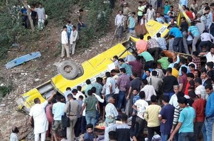 Many feared dead as school bus with 60 students falls into gorge.