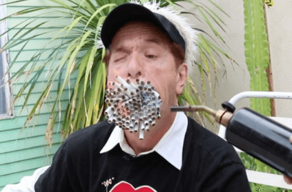 Man with a big mouth smokes 130 cigarettes at the same time